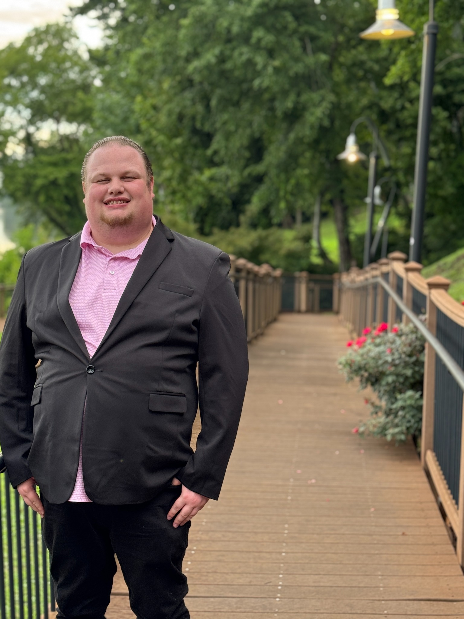 Lane Vanveckhoven in a black jacket and pink shirt